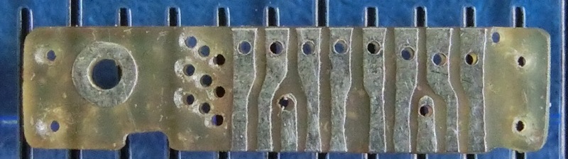 Small PCB - 10.5mm long, holes 0.25mm and 0.6mm. Tinned before drilling.