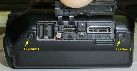 2 of 6 screws holding rear cover